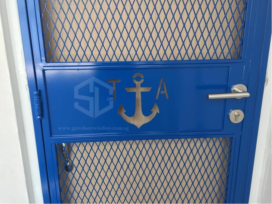 Nautical entryway with blue metal gate and white anchor