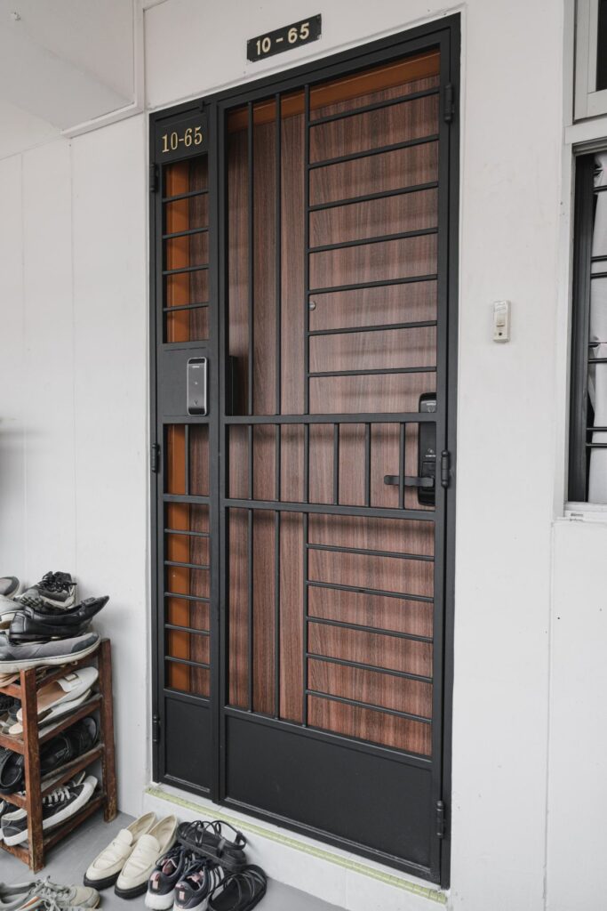 main door with gate and lock