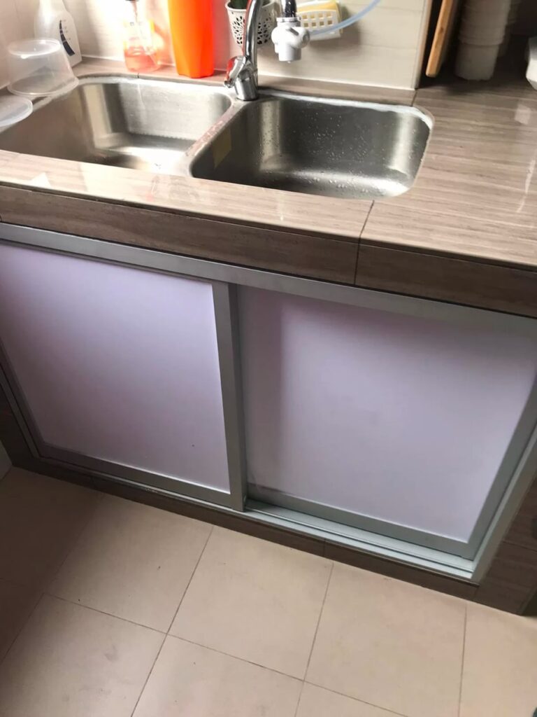 stainless steel kitchen sink with a single basin and a faucet