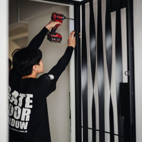 gdw employees installing mild steel gate