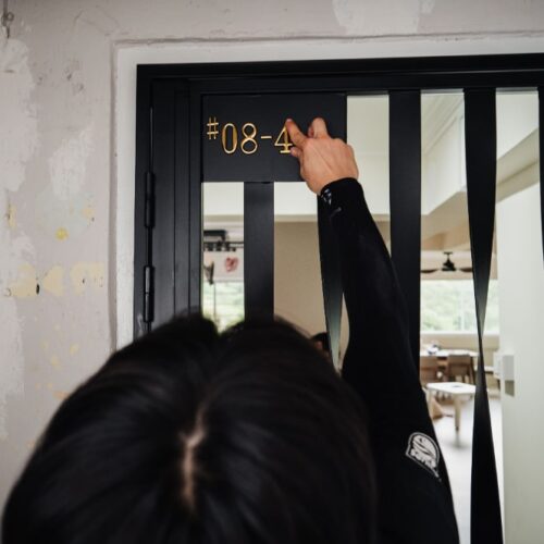 gdw employees installing unit number on mild steel gate1