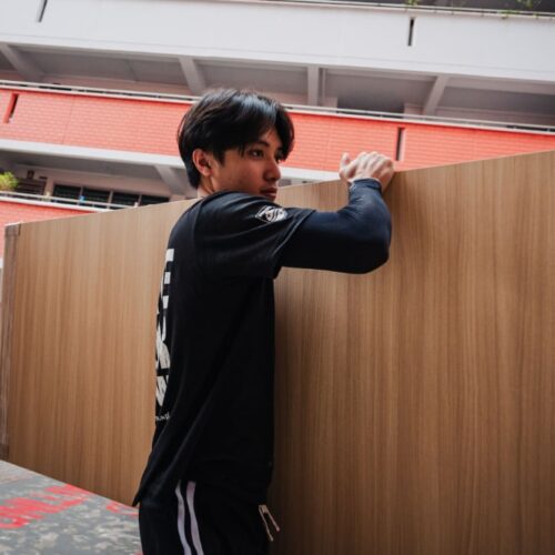 gdw employees carry wooden door