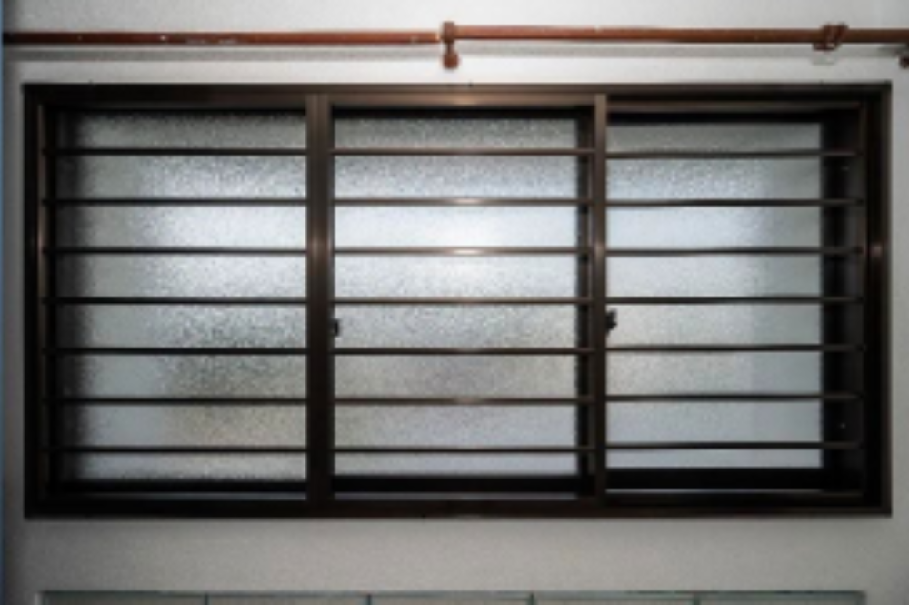 Sliding Window with Grilles Bronze Frame with Orange Skin Glass