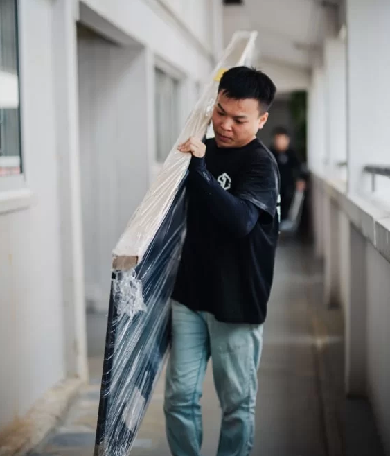 gdw employees carry mild steel gate to customer's house